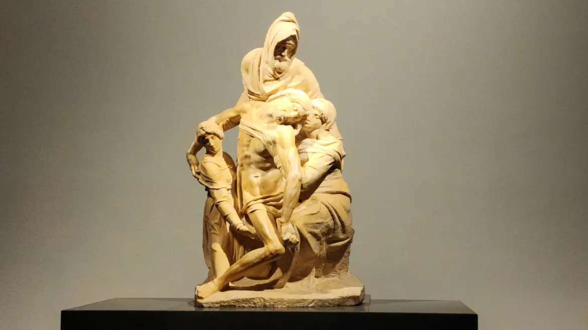 Michelangelo Bandini Pieta Deposition sculpture at Museo dell Opera del Duomo in Florence showing the unfinished marble figures against warm gallery lighting