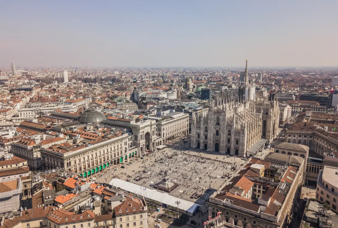 Aerial view of Milan, Italy, showcasing the Duomo di Milano, Galleria Vittorio Emanuele II, and Piazza del Duomo