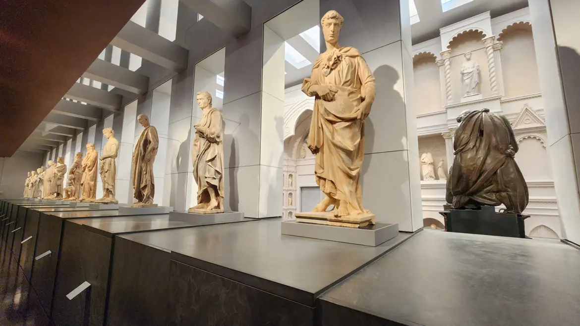 Interior of the Museo dell’Opera del Duomo in Florence showcasing Renaissance sculptures architectural elements and original masterpieces preserved from the Cathedral Baptistery and Bell Tower