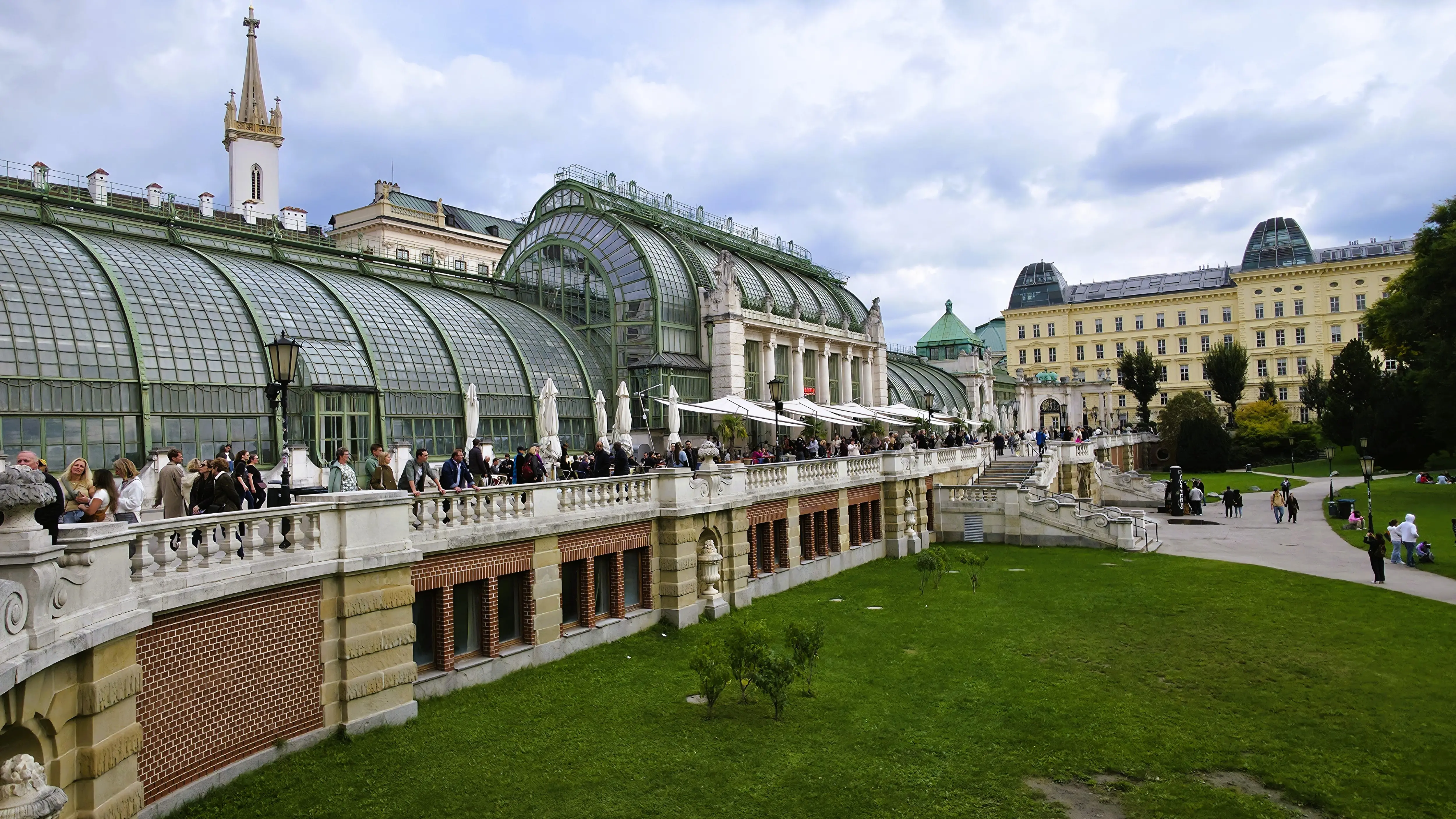The Palmenhaus (Palm House) in Burggarten, Vienna, an elegant glass-and-iron greenhouse blending with the imperial gardens