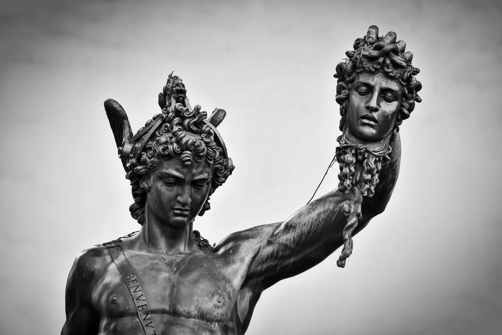 Close-up of Benvenuto Cellini bronze sculpture Perseus with the Head of Medusa at the Loggia dei Lanzi in Florence showing dramatic detail and expression