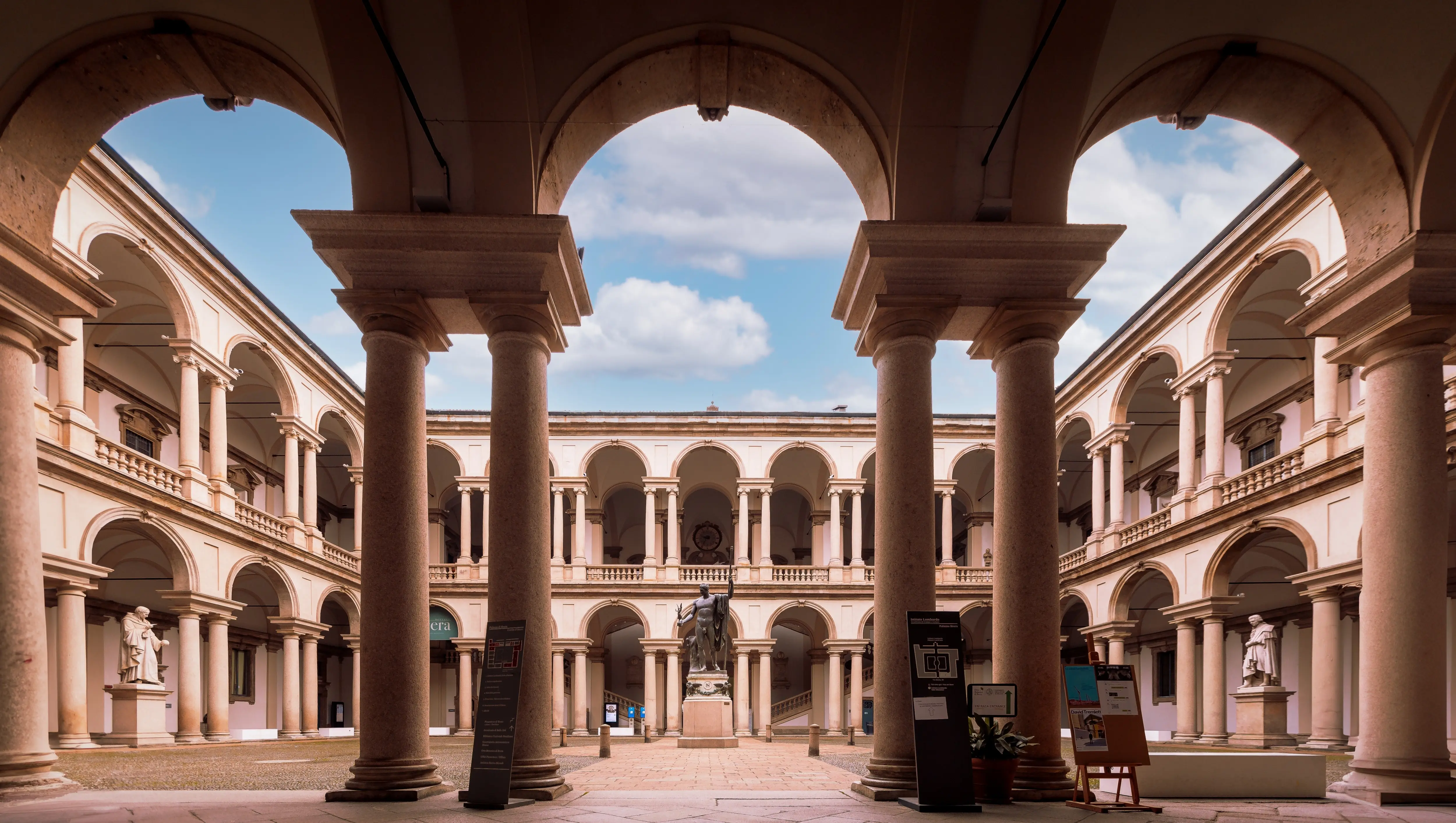Courtyard of the Pinacoteca di Brera in Milan, Italy, featuring classical architecture and a calm enclosed atmosphere