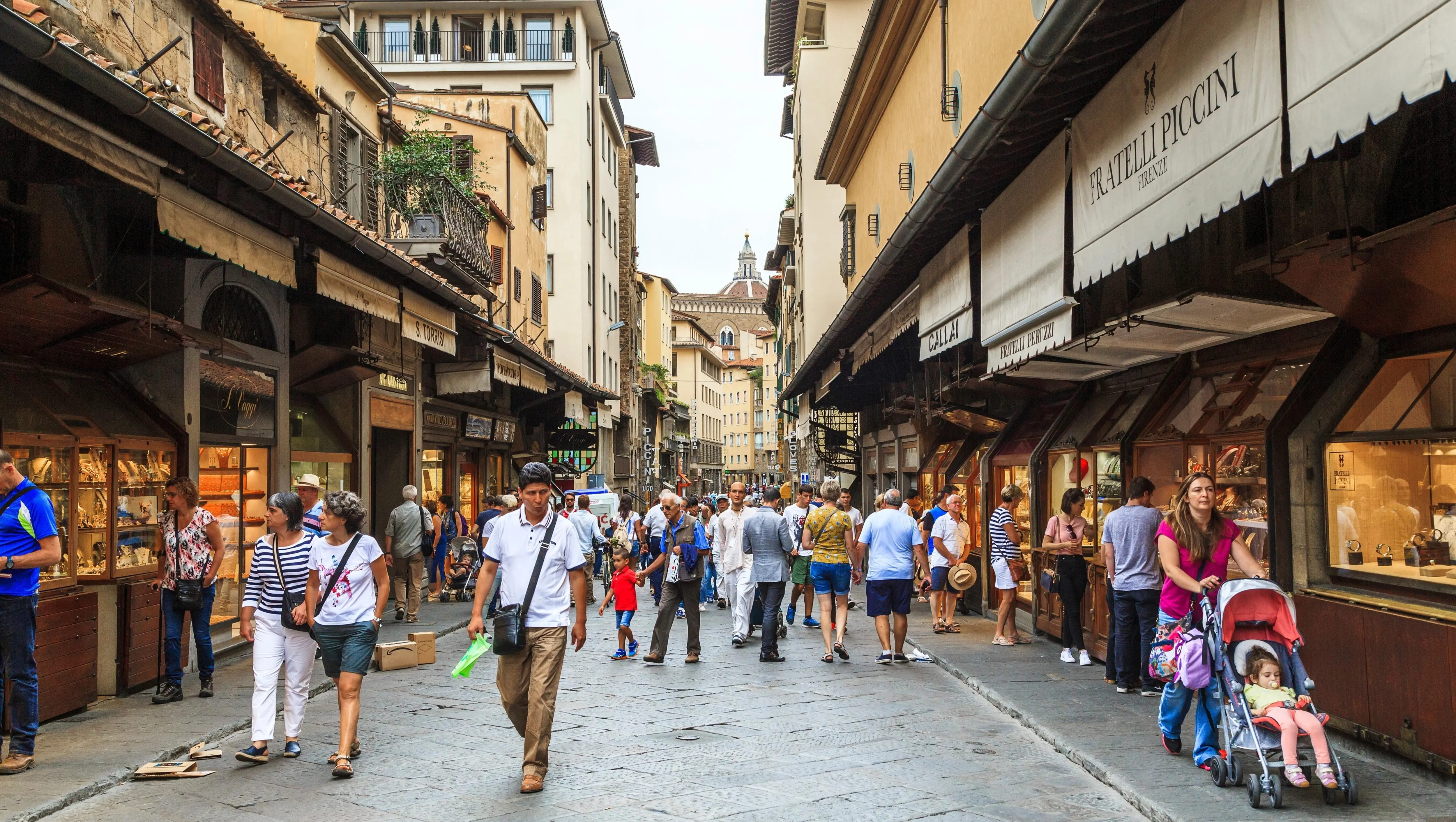 Shops and visitors along Ponte Vecchio, Florence’s most famous medieval bridge
