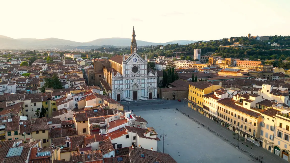 Santa Croce Basilica Piazza Aerial View Florence Aerial view of Piazza Santa Croce and the Basilica di Santa Croce in Florence showing the Neo-Gothic marble facade and surrounding historic architecture at golden hour