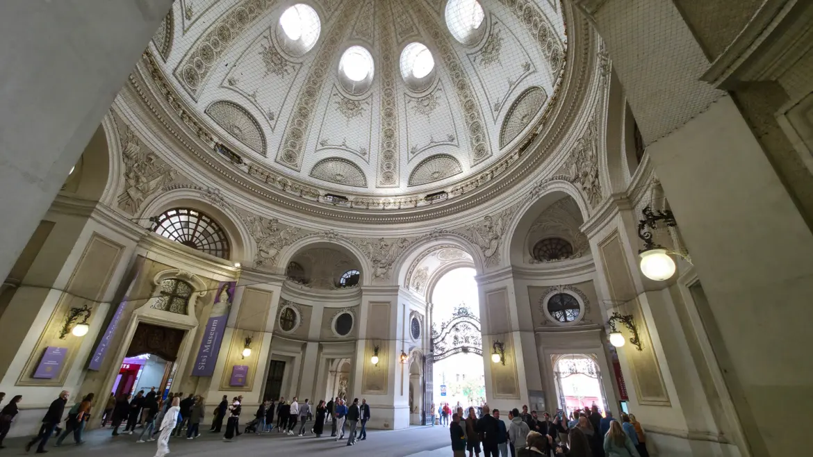 Entrance to the Sisi Museum within the Michaelertrakt of the Hofburg Palace, viewed beneath the ornate dome