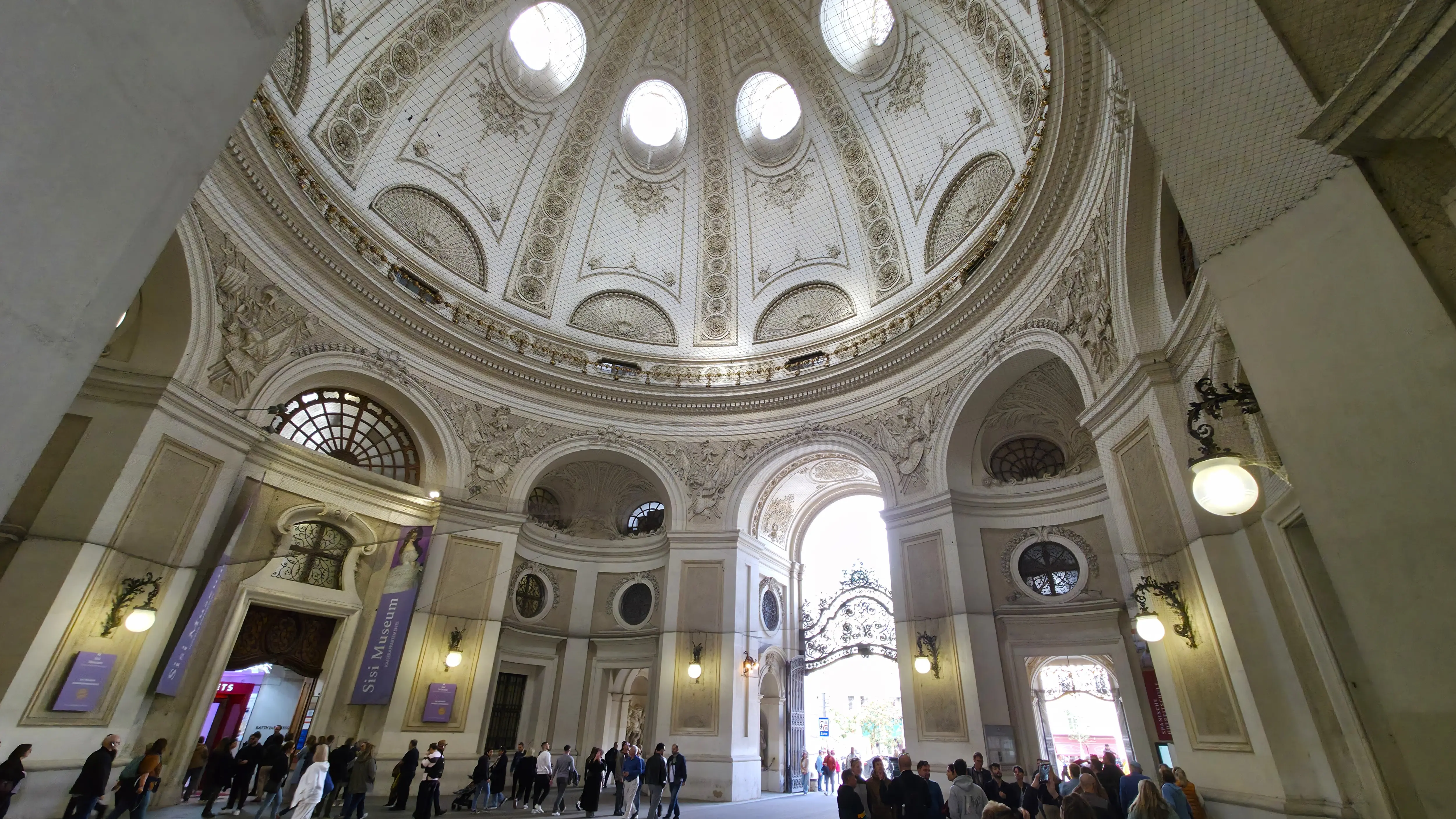 Entrance to the Sisi Museum within the Michaelertrakt of the Hofburg Palace, viewed beneath the ornate dome