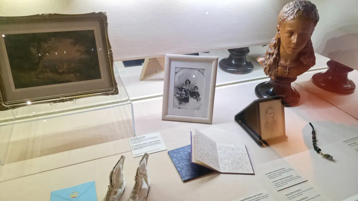 Personal items of Empress Elisabeth (Sisi) at the Sisi Museum, including family photographs and baby shoes