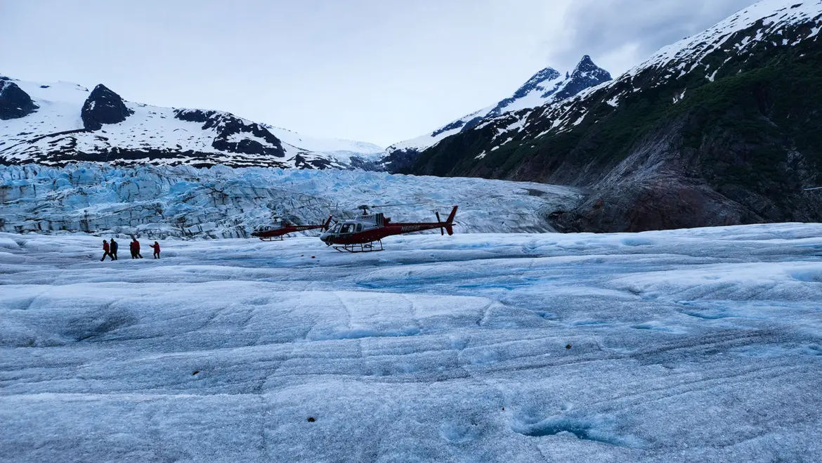 Temsco Helicopter Landed Mendenhall Glacier Tour Group Juneau A TEMSCO helicopter landed on the Mendenhall Glacier with tour group and guides in Juneau, Alaska