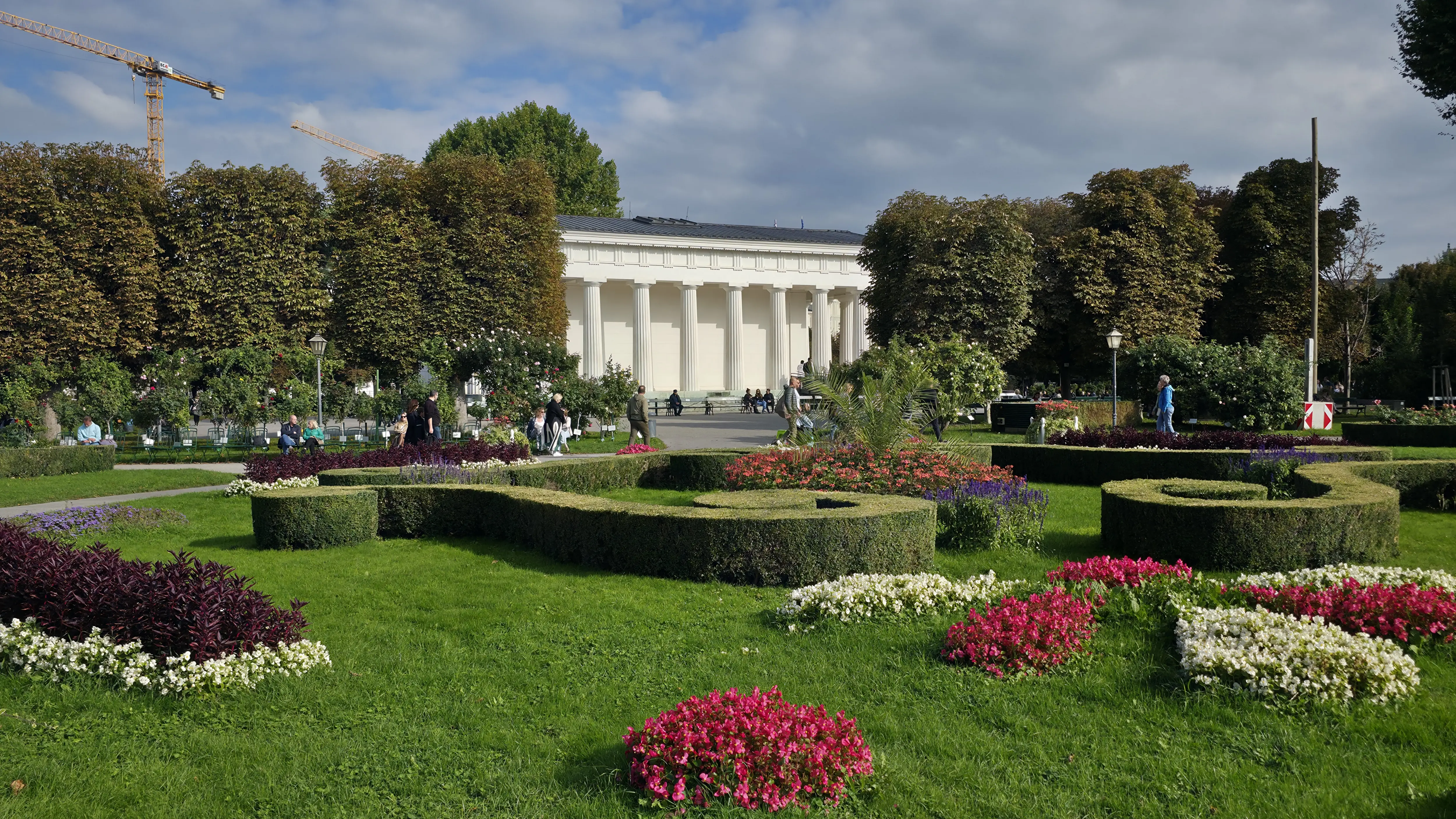 Theseustempel set within gardens Volksgarten Vienna Austria classical pavilion surrounded greenery calm built early 19th century ancient Greek ideals peaceful architectural presence rest reflection everyday use