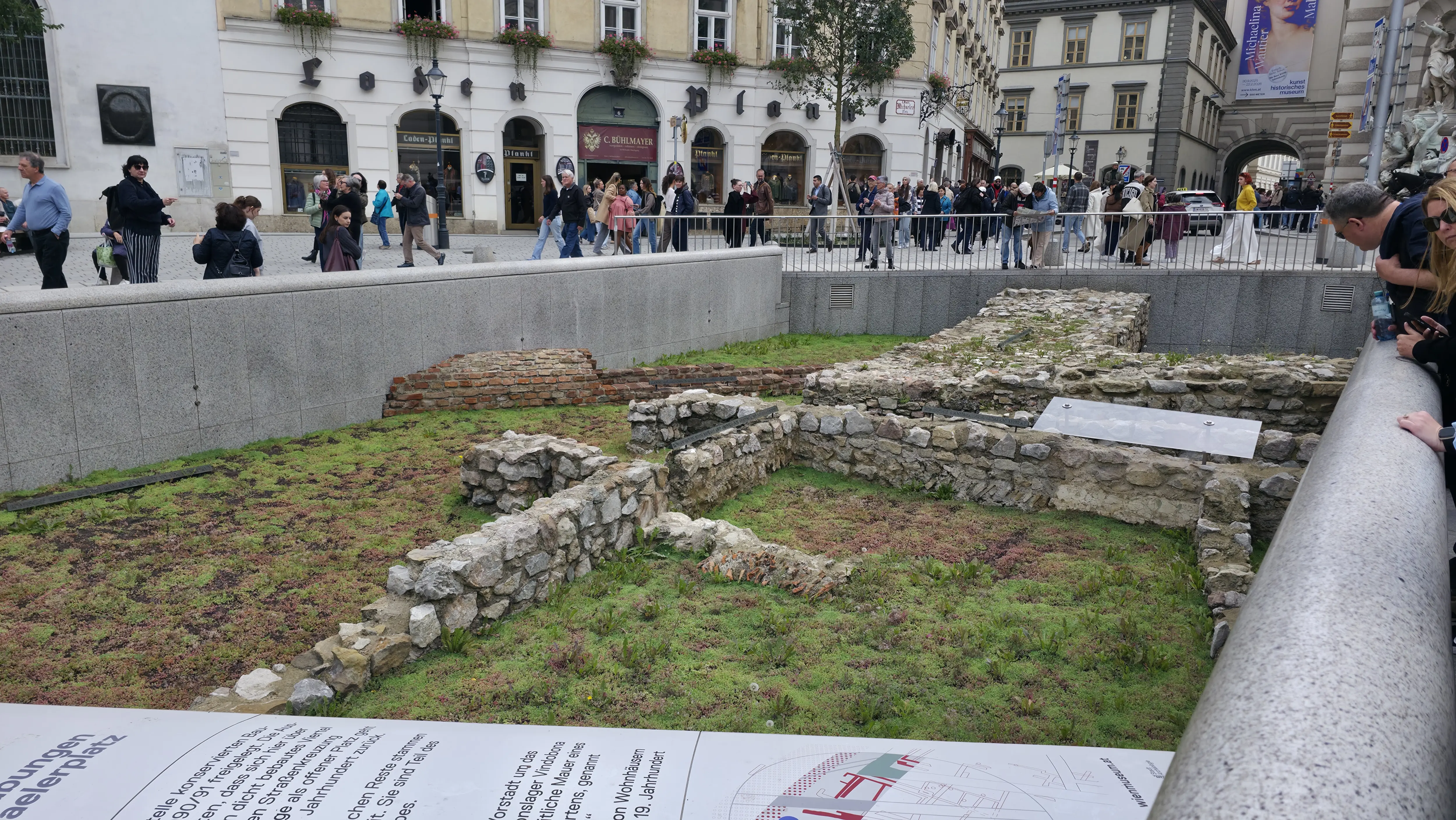 Looking down into the Vindobona ruins at Michaelerplatz, showing preserved Roman foundations beneath the modern square