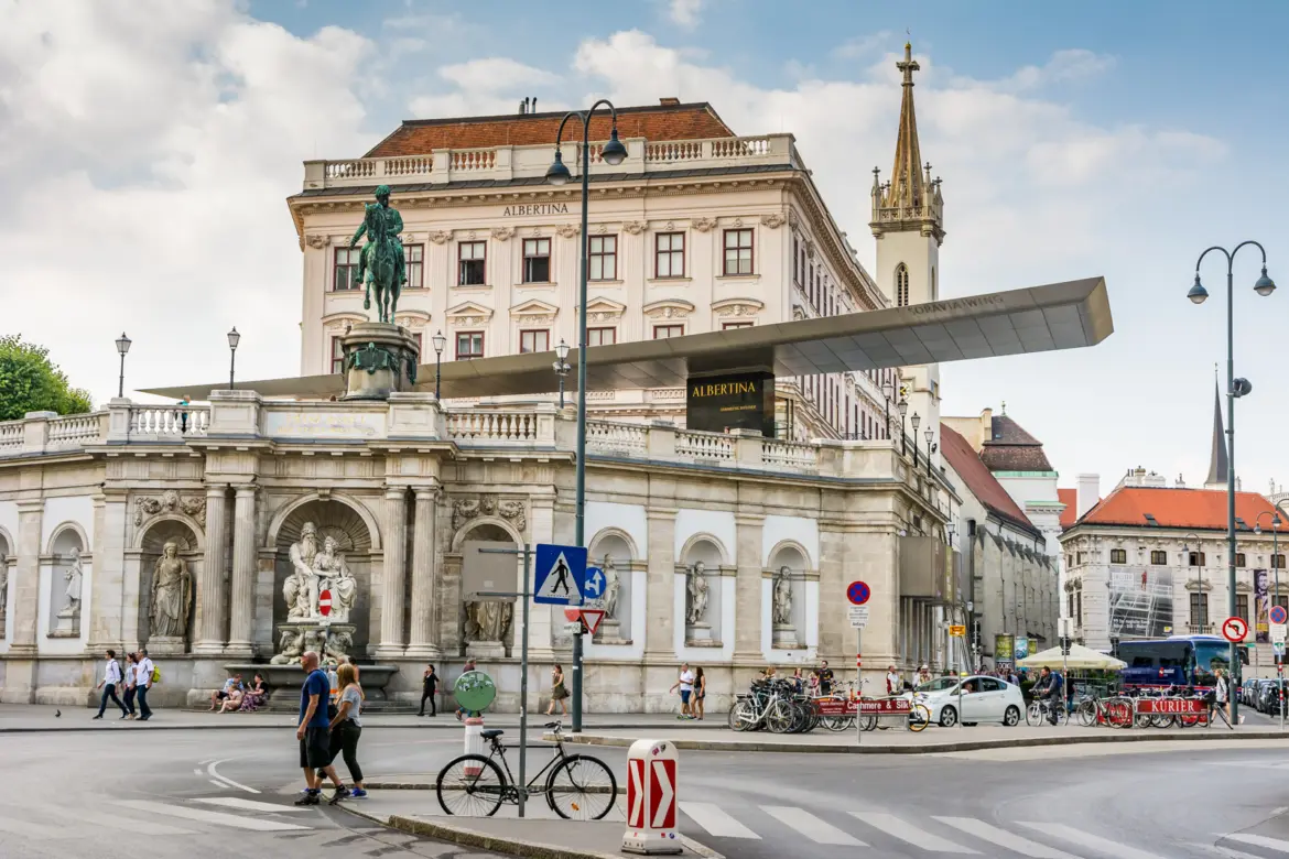 Albertinaplatz in Vienna featuring the Albertina museum, the Archduke Albrecht equestrian statue, and the Neptune Fountain