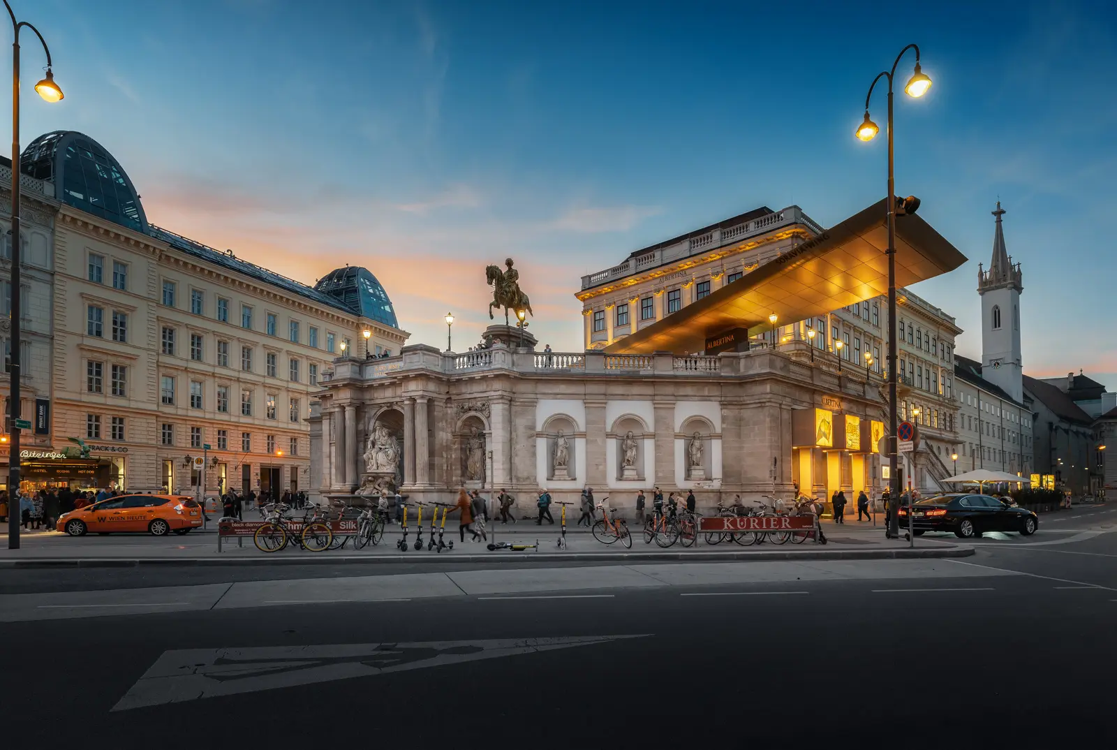 Albertinaplatz in Vienna illuminated in the evening with soft light on the Albertina and surrounding architecture