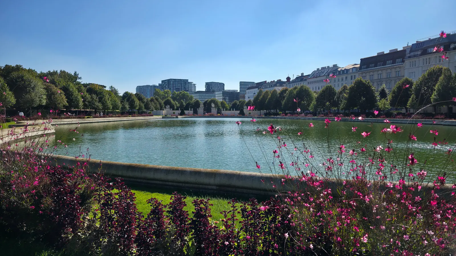 The reflecting pool at Upper Belvedere in Vienna, highlighting the symmetry, elegance, and timeless beauty of the Belvedere Palace gardens.