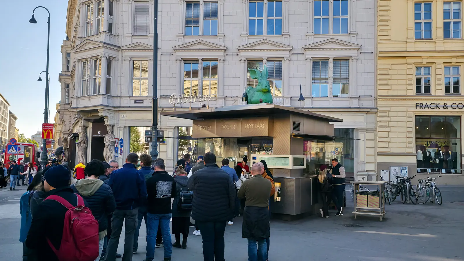 Locals and tourists lining up at Bitzinger Würstelstand near the Albertina Museum in Vienna