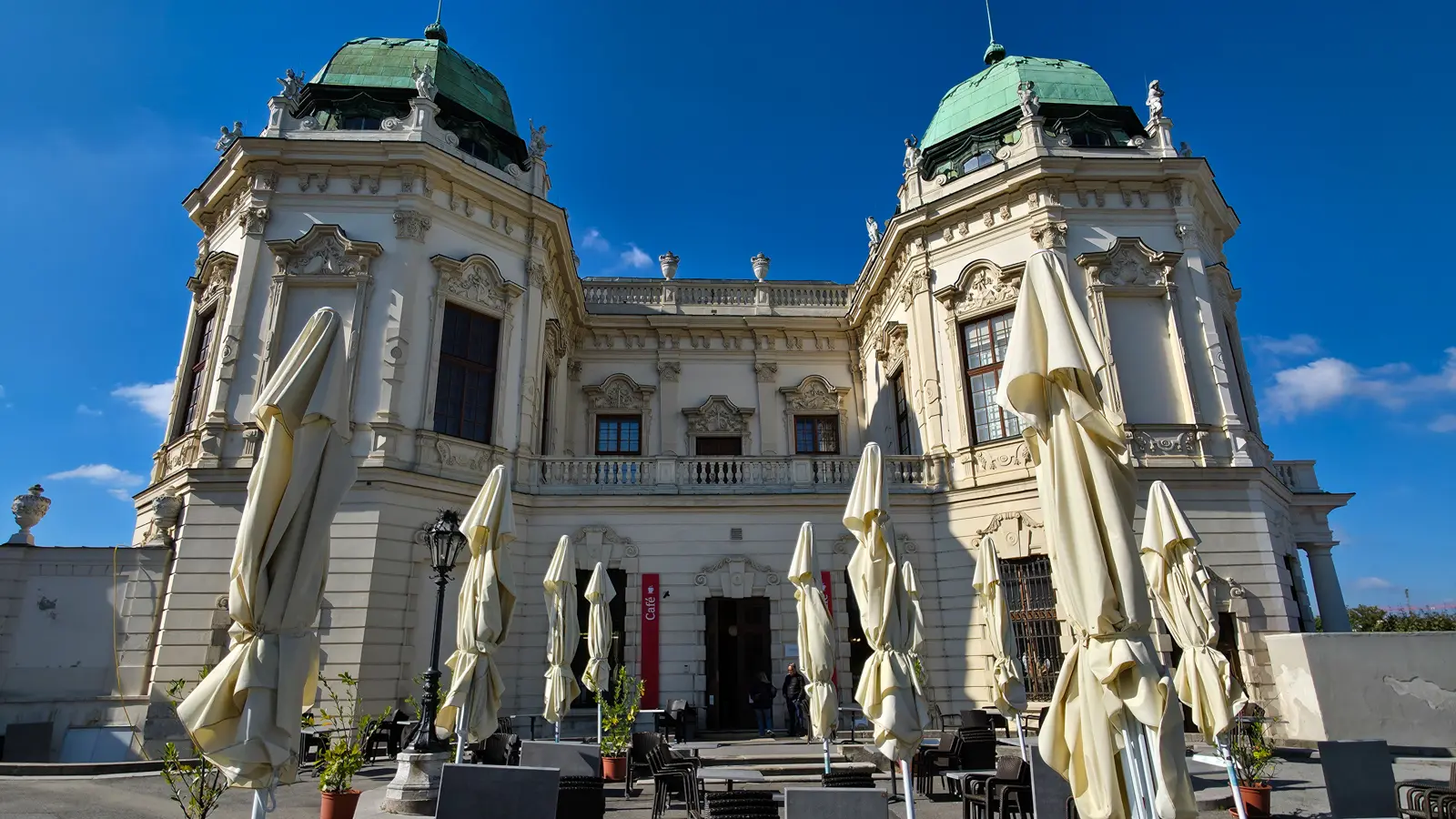 Outdoor view of the café at the Upper Belvedere Palace in Vienna surrounded by Baroque architecture and gardens