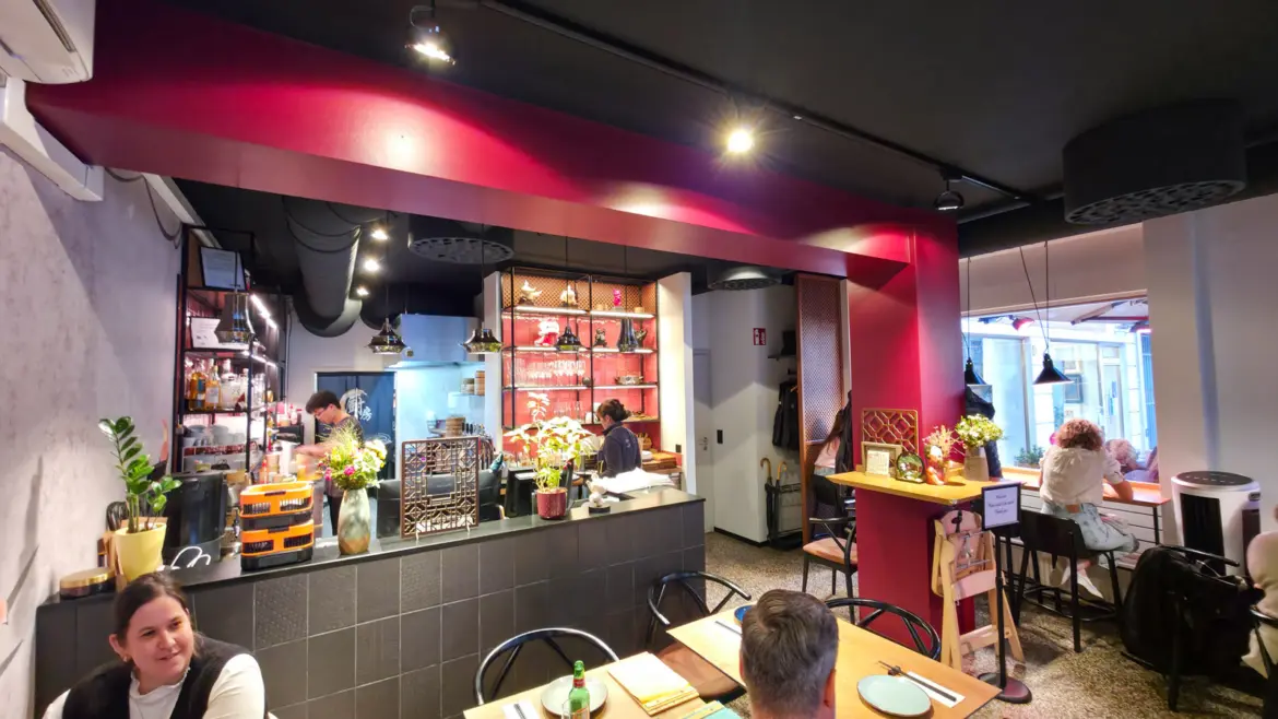 The elegant interior of Chinacy restaurant in Vienna, with modern furnishings, warm lighting, and subtle Asian-inspired design details