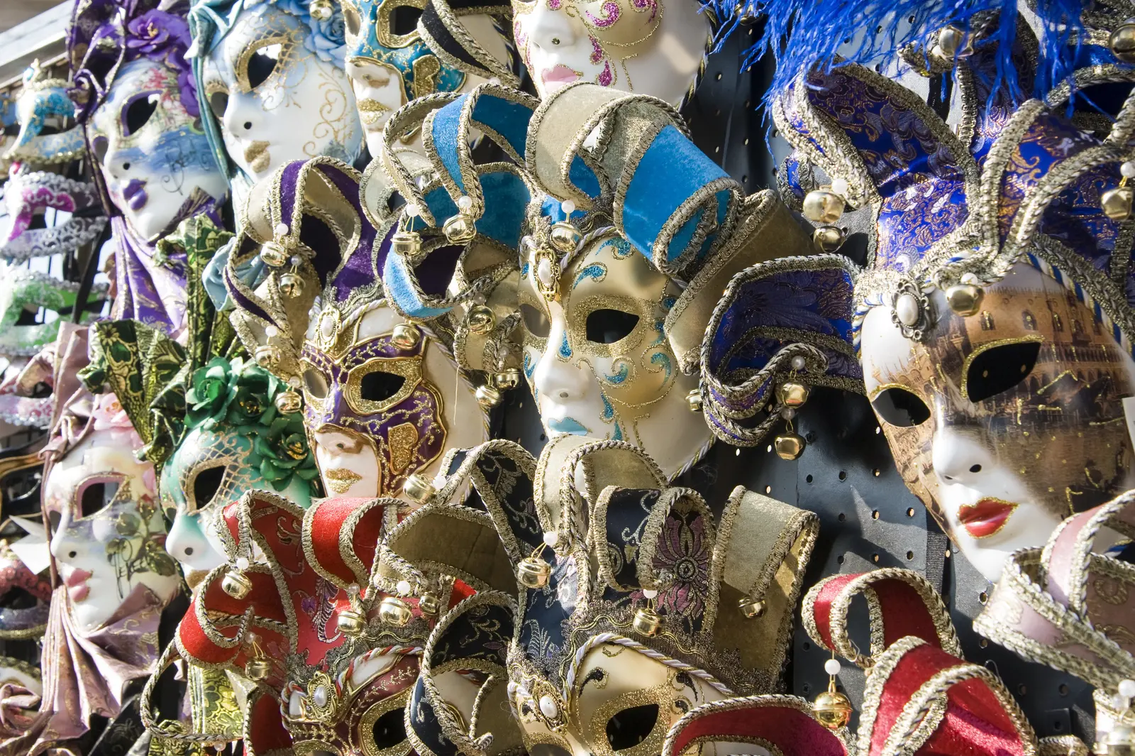 Vibrant Venetian Carnival masks showcasing traditional craftsmanship, rich colors, and ornate details in Venice