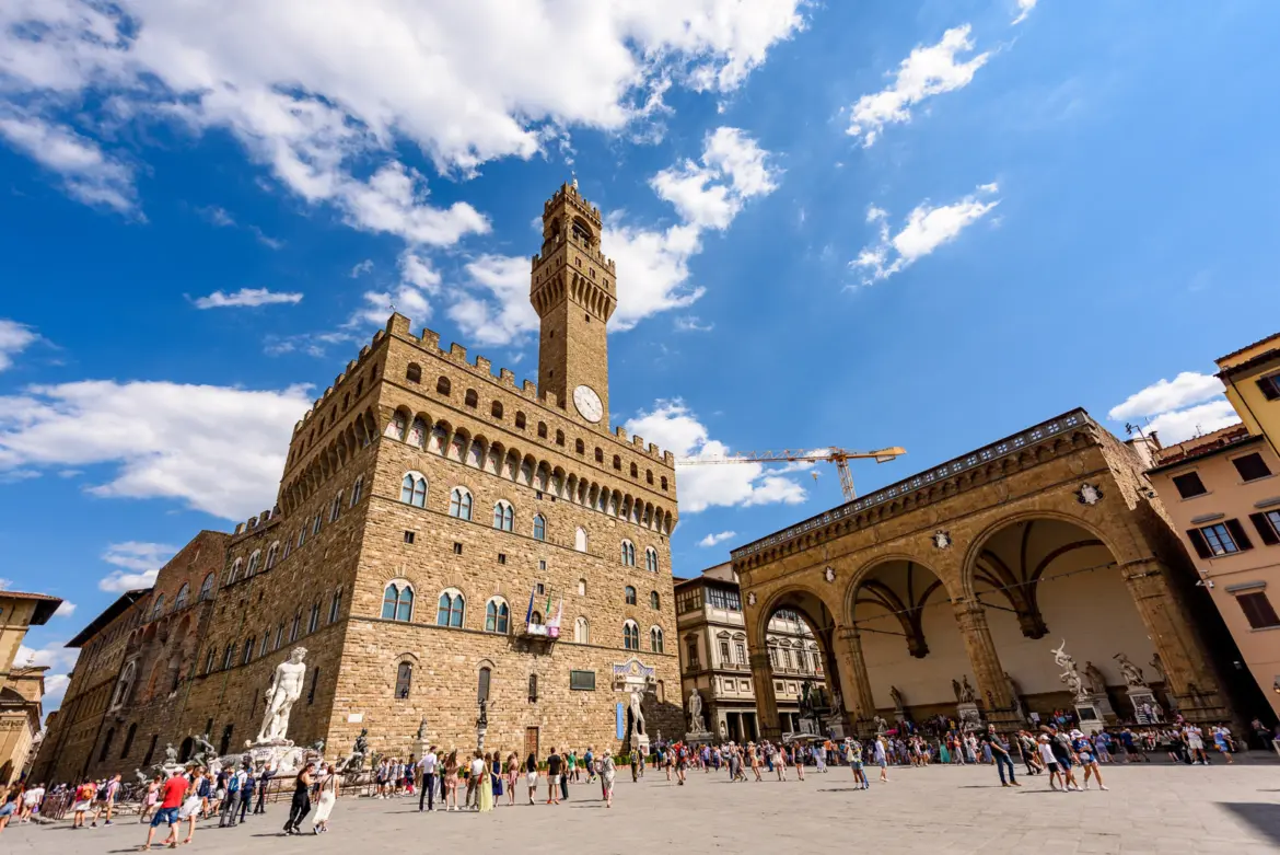 Piazza della Signoria in Florence with the imposing Palazzo Vecchio and the open-air Loggia dei Lanzi sculpture gallery