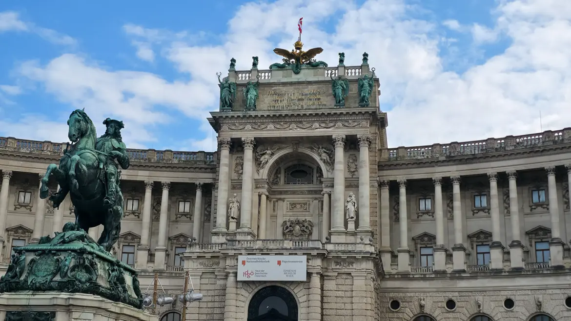 The central entrance and balcony of the Neue Burg overlooking Heldenplatz in Vienna, where Adolf Hitler announced the Anschluss in March 1938, with the Prince Eugene statue in the foreground