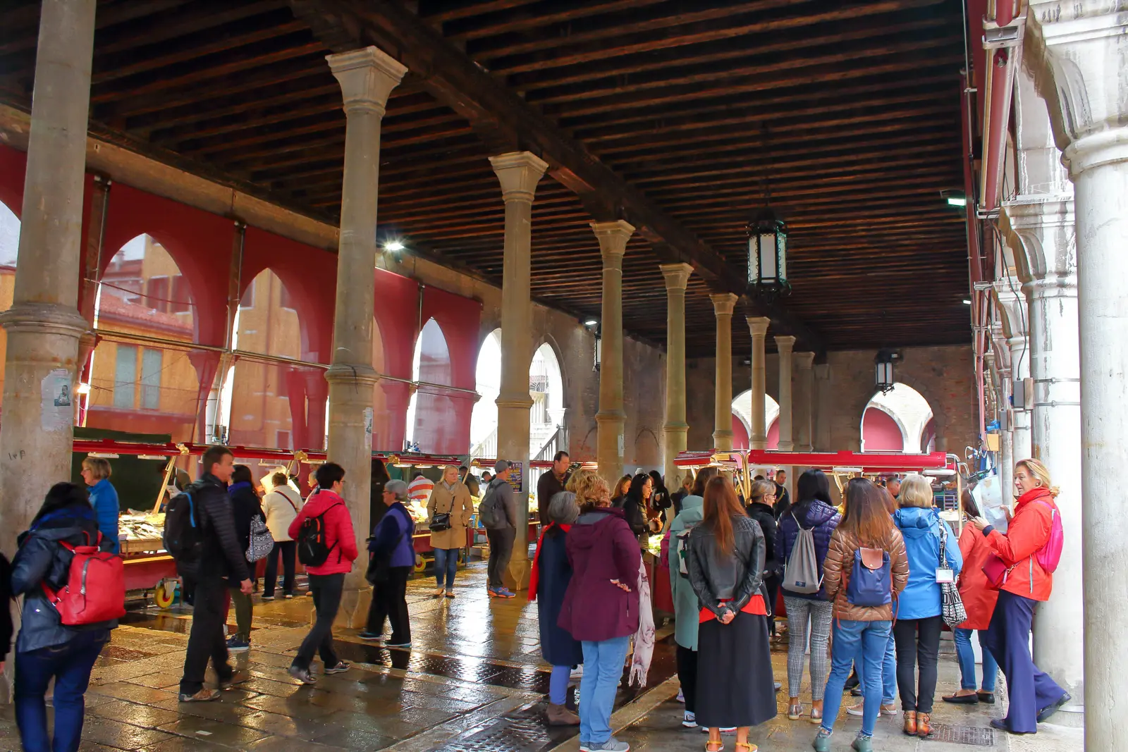 The historic loggia of the Rialto Market in Venice, Italy, with its arches and market stalls