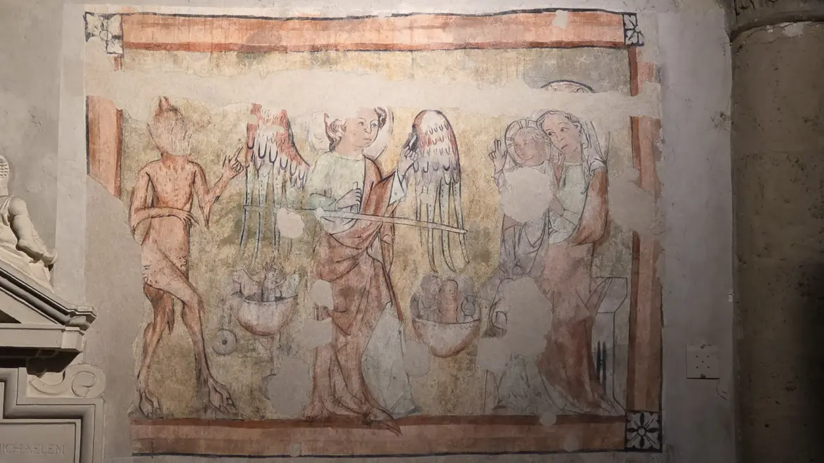 A preserved medieval wall painting inside St. Michael’s Church in Vienna, discovered beneath later layers during restoration