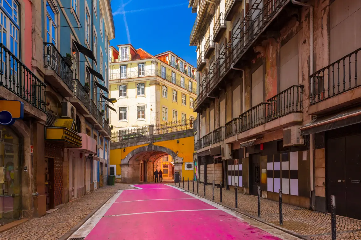 Pink Street (Rua Nova do Carvalho) in Lisbon, Portugal, with its vivid pink-painted pavement and colorful buildings