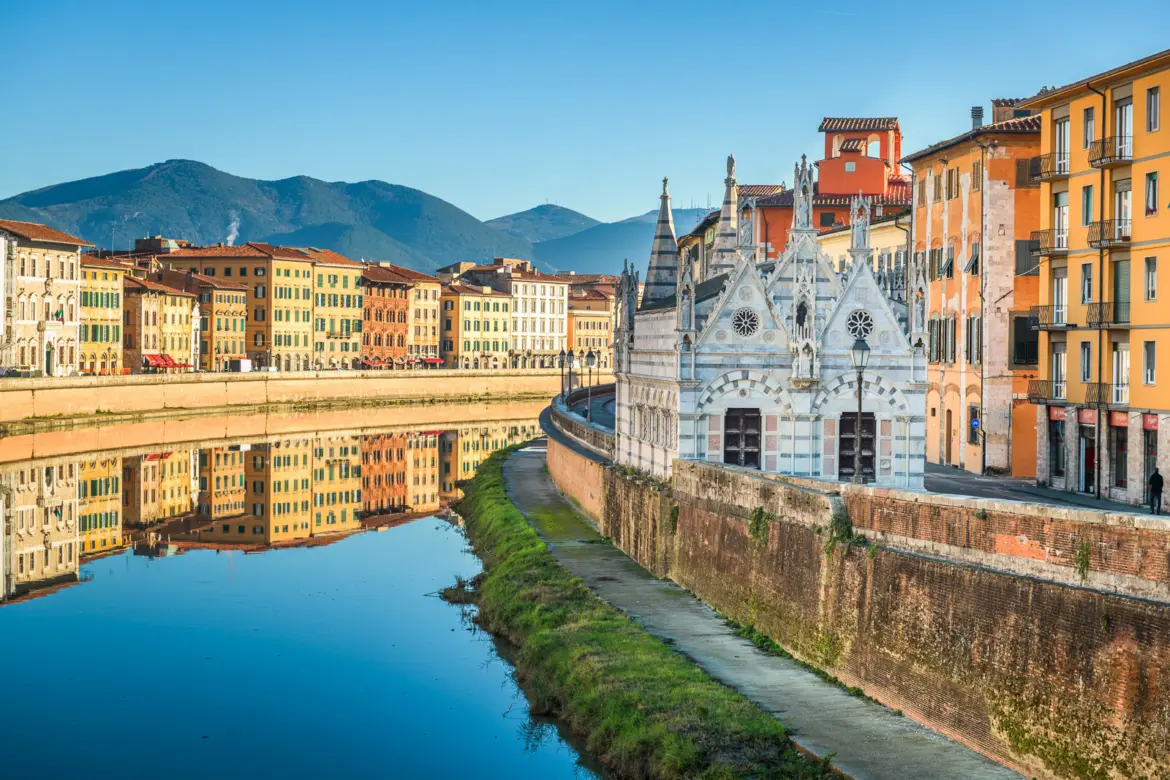 The Gothic Church of Santa Maria della Spina along the Arno River in Pisa, Italy, part of the historic skyline