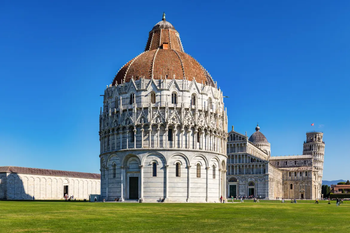 Piazza dei Miracoli in Pisa with the Baptistery in the foreground and the cathedral and Leaning Tower beyond, a UNESCO World Heritage site