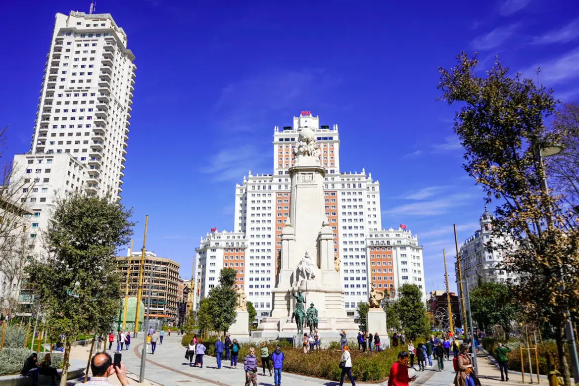 Plaza de España overview with Cervantes Monument and Edificio España in Madrid on a sunny day