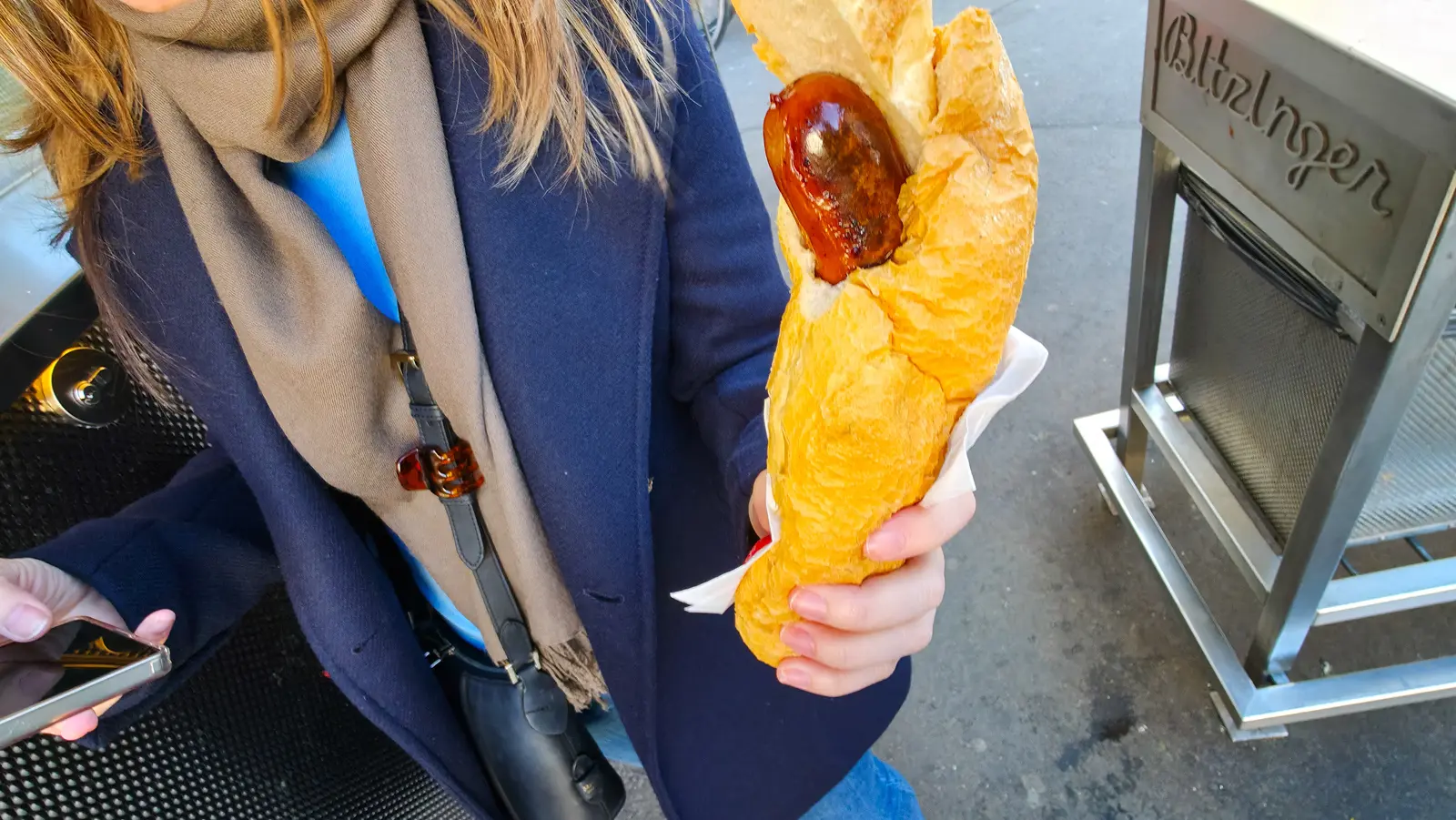 Seppreziner sausage in a bread roll from Bitzinger Würstelstand in Vienna, a specialty developed by Sepp Bitzinger himself