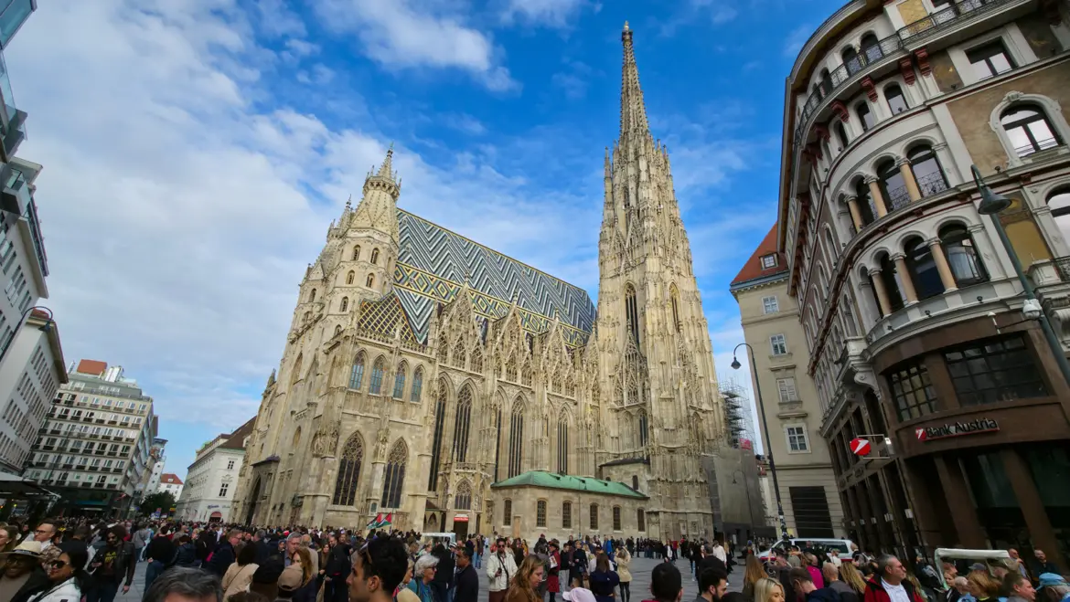 St. Stephen’s Cathedral towering over the lively Stephansplatz, the historic heart of Vienna, with crowds of visitors below