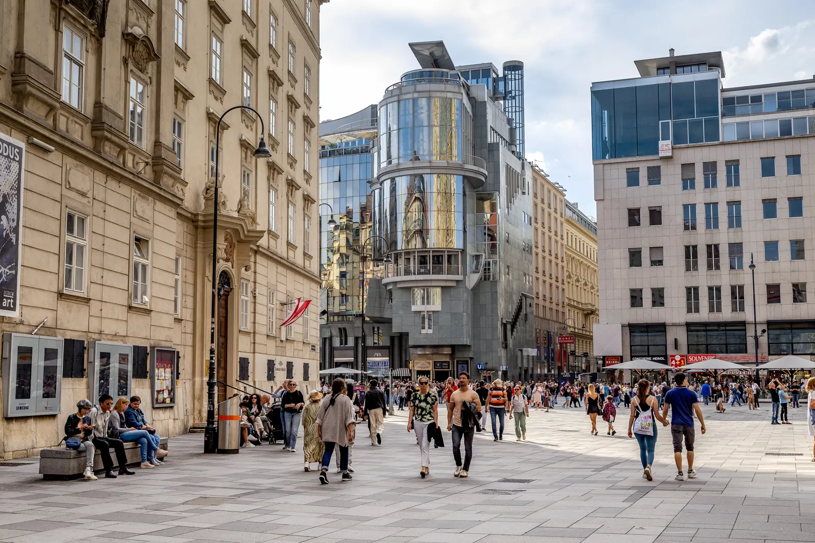 Visitors and locals walking through Stephansplatz in Vienna surrounded by historic and modern architecture