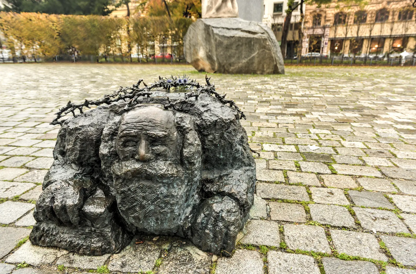 The Street-Washing Jew sculpture with barbed wire at the Memorial Against War and Fascism in Vienna