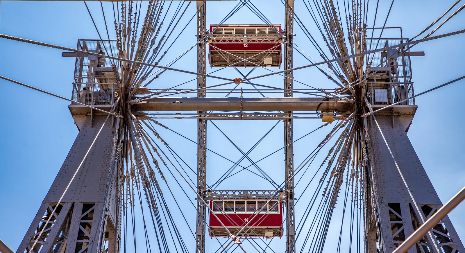 Close-up view from inside a Wiener Riesenrad cabin showcasing the wheel’s structural framework and surrounding cabins at Vienna’s Prater