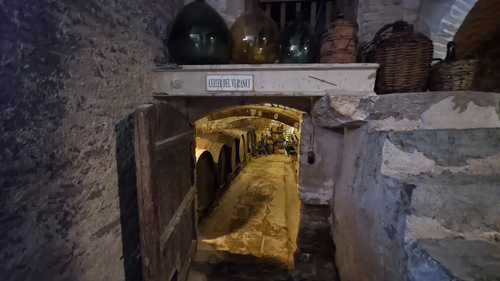 The original underground wine cellar beneath Masia Roqueta at Abadal Winery, still intact after centuries, revealing how wine was made long before modern technology existed