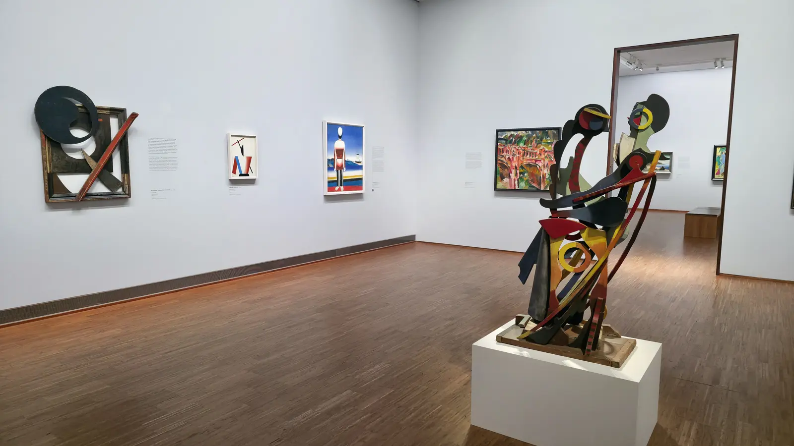 Interior gallery at the Albertina Museum in Vienna showcasing a thoughtfully curated modern art space with sculpture and paintings