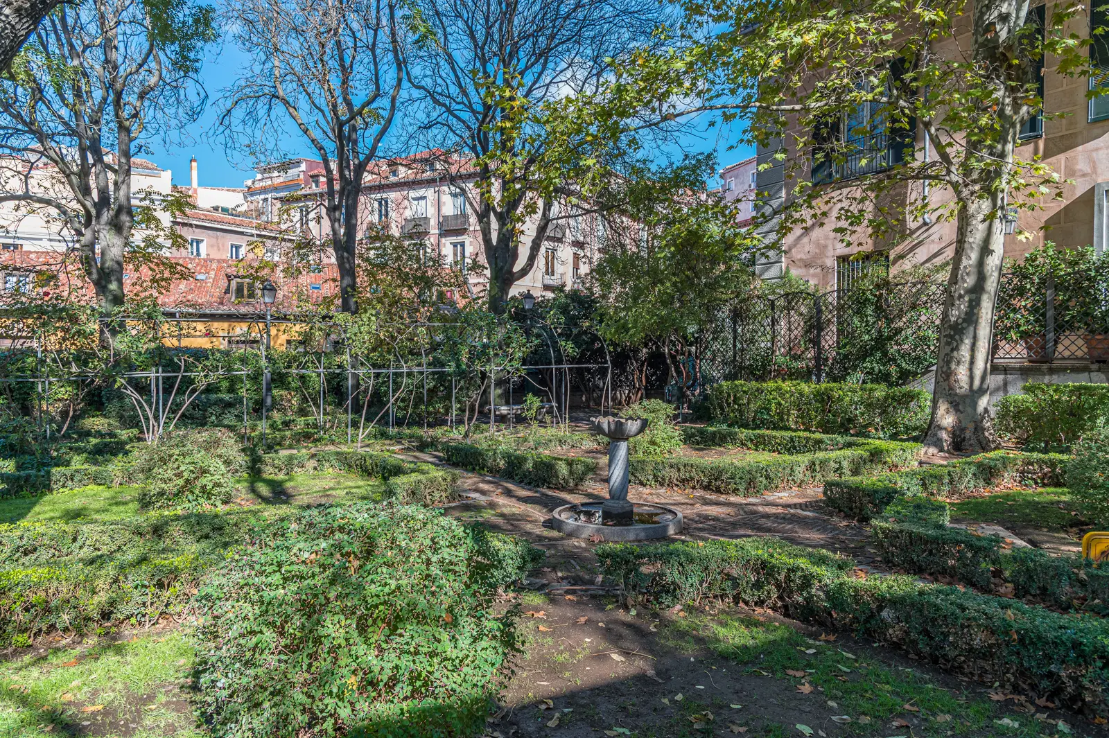 Pergola with climbing ivy and vine-covered walls in the Anglona Garden in La Latina Madrid