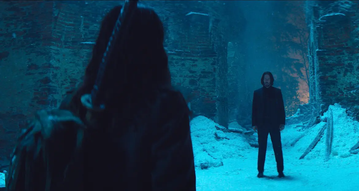 Ana de Armas as Eve Macarro and Keanu Reeves as John Wick in a snow-covered Hallstatt scene from Ballerina (2025), courtesy of Lionsgate