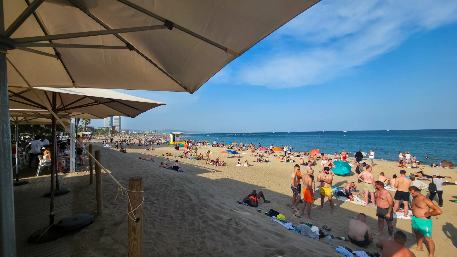 Barceloneta Beach shoreline with Mediterranean waves and sand along Barcelona's coast