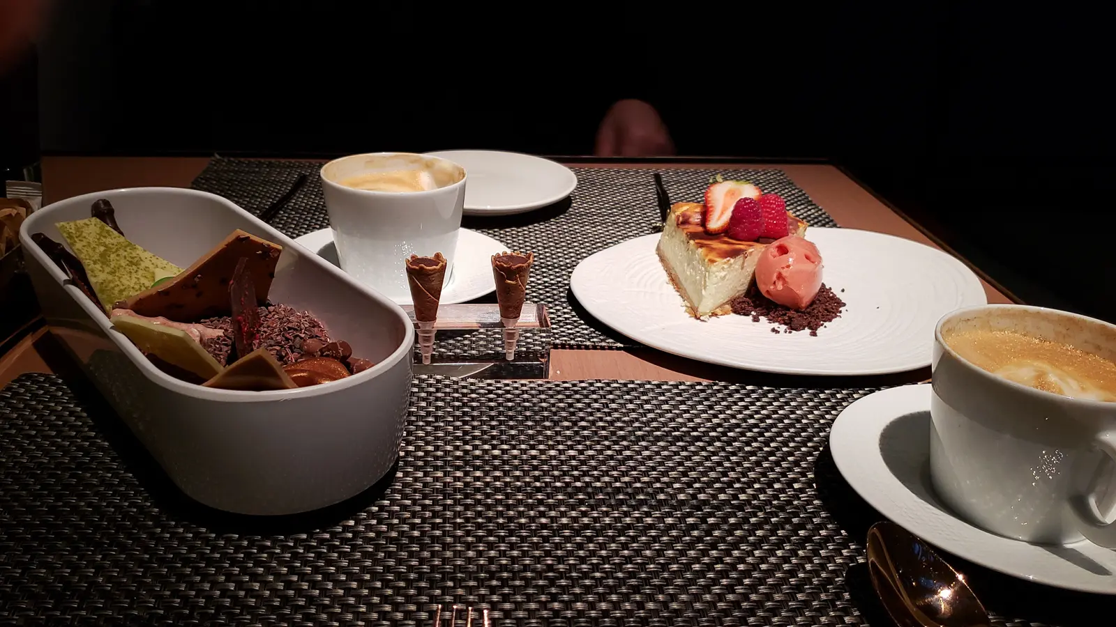 Strawberry cheesecake and an artful assortment of chocolates at Blanc, Mandarin Oriental Barcelona — creamy, silky, and impossibly smooth, with berries so bright they taste like early summer