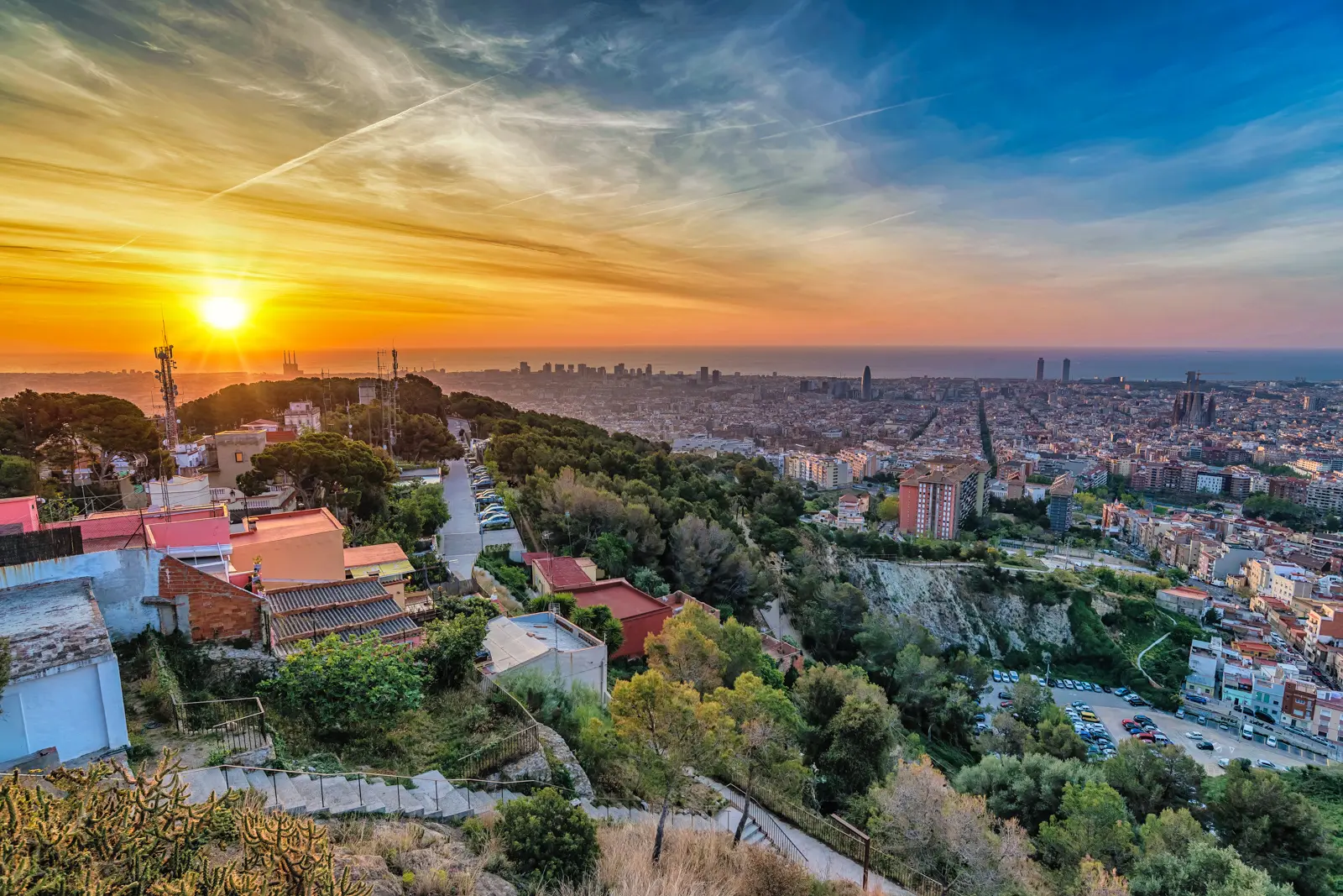 The panoramic view of Barcelona from the Bunkers del Carmel on Turó de la Rovira — originally anti-aircraft defenses built during the Spanish Civil War, now a 360° viewpoint stretching from the mountains to the sea