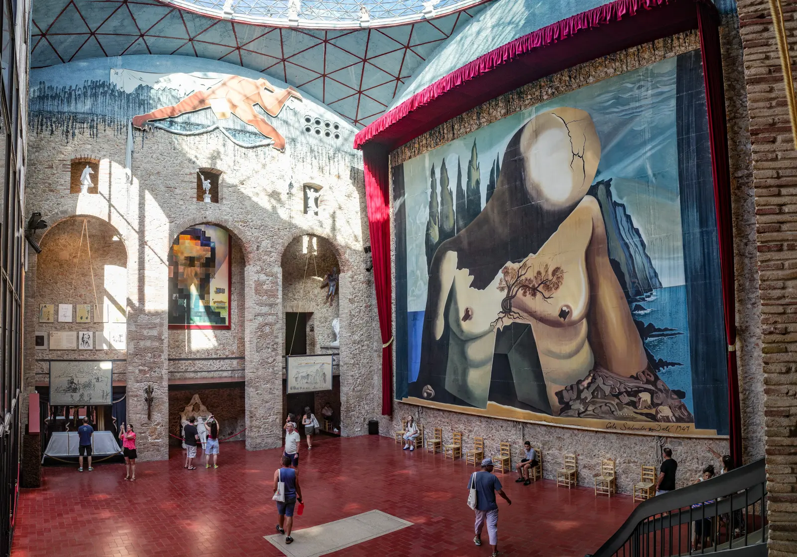 The Dalí Theatre-Museum in Figueres with its iconic crimson walls, golden bread ornaments, and colossal rooftop eggs — an immersive surreal universe designed by the artist himself