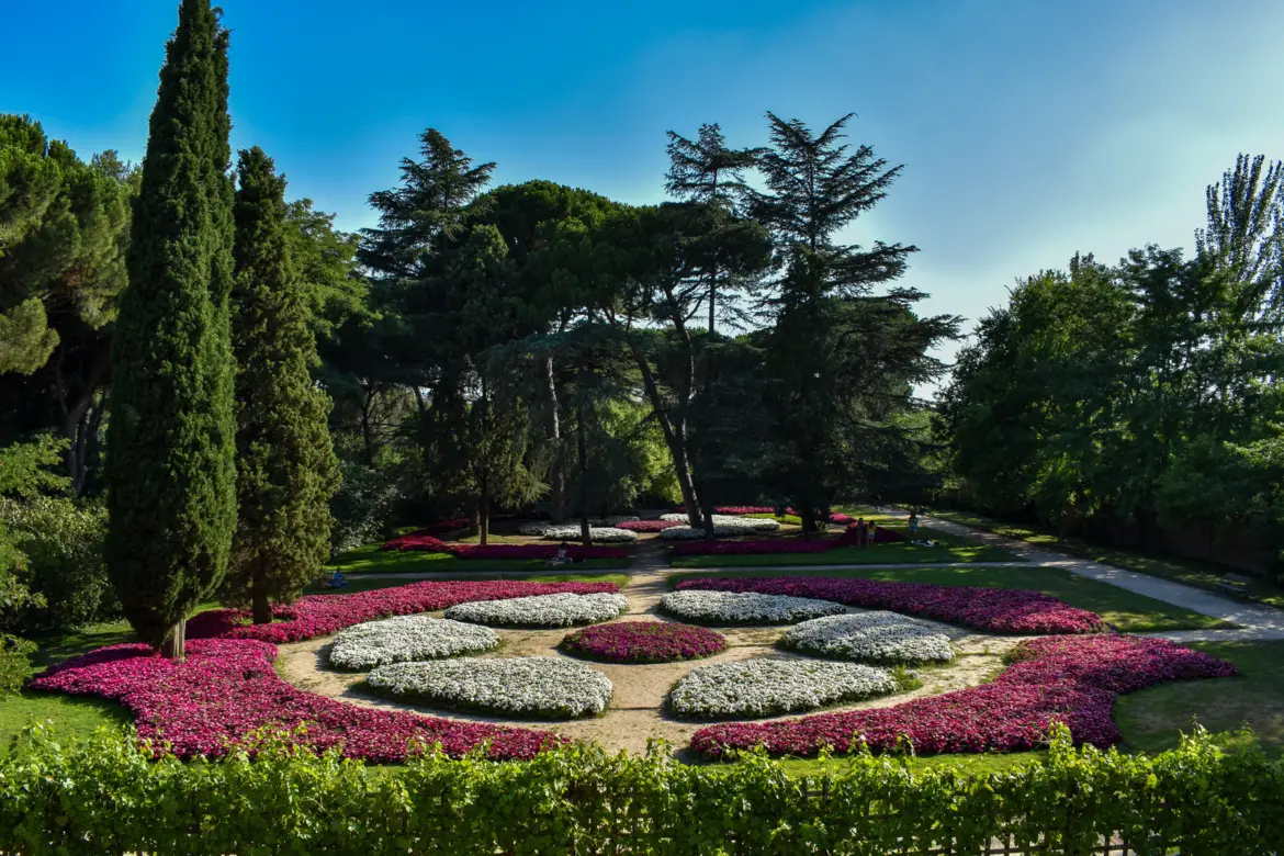 El Capricho Park in Madrid with ornamental flower gardens in pink and white, one of the city's most romantic and least-known green spaces