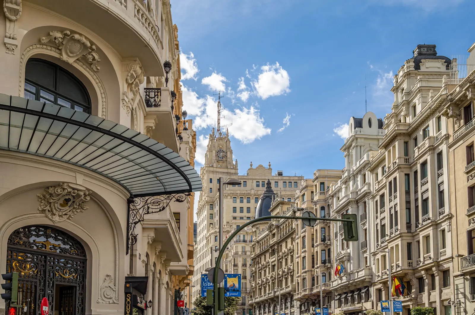Grand theatrical facades along Gran Vía in Madrid, showcasing the boulevard's rich blend of early 20th-century architectural styles