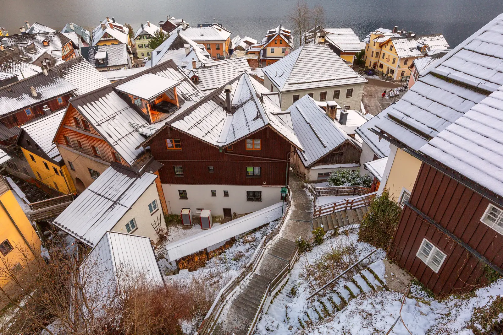 Narrow streets, winding passages, and stairways in Hallstatt during winter, creating a cinematic village setting