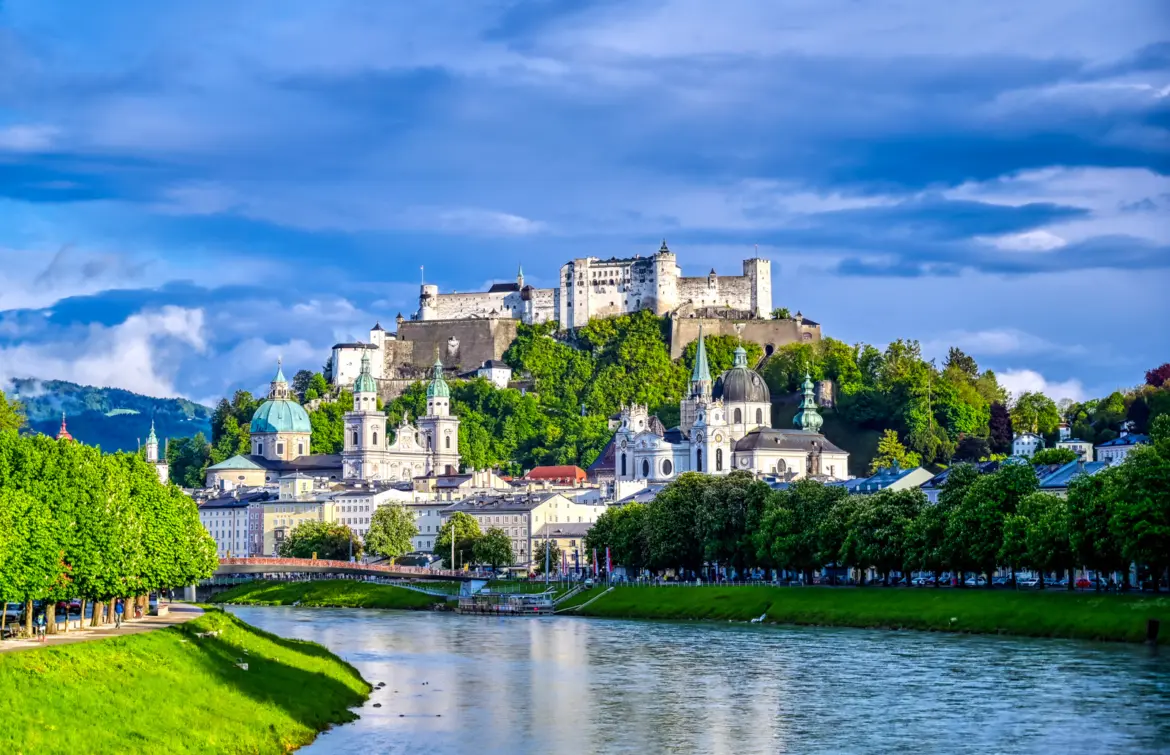 Hohensalzburg Fortress rising above Salzburg Old Town seen from the Salzach River in Austria