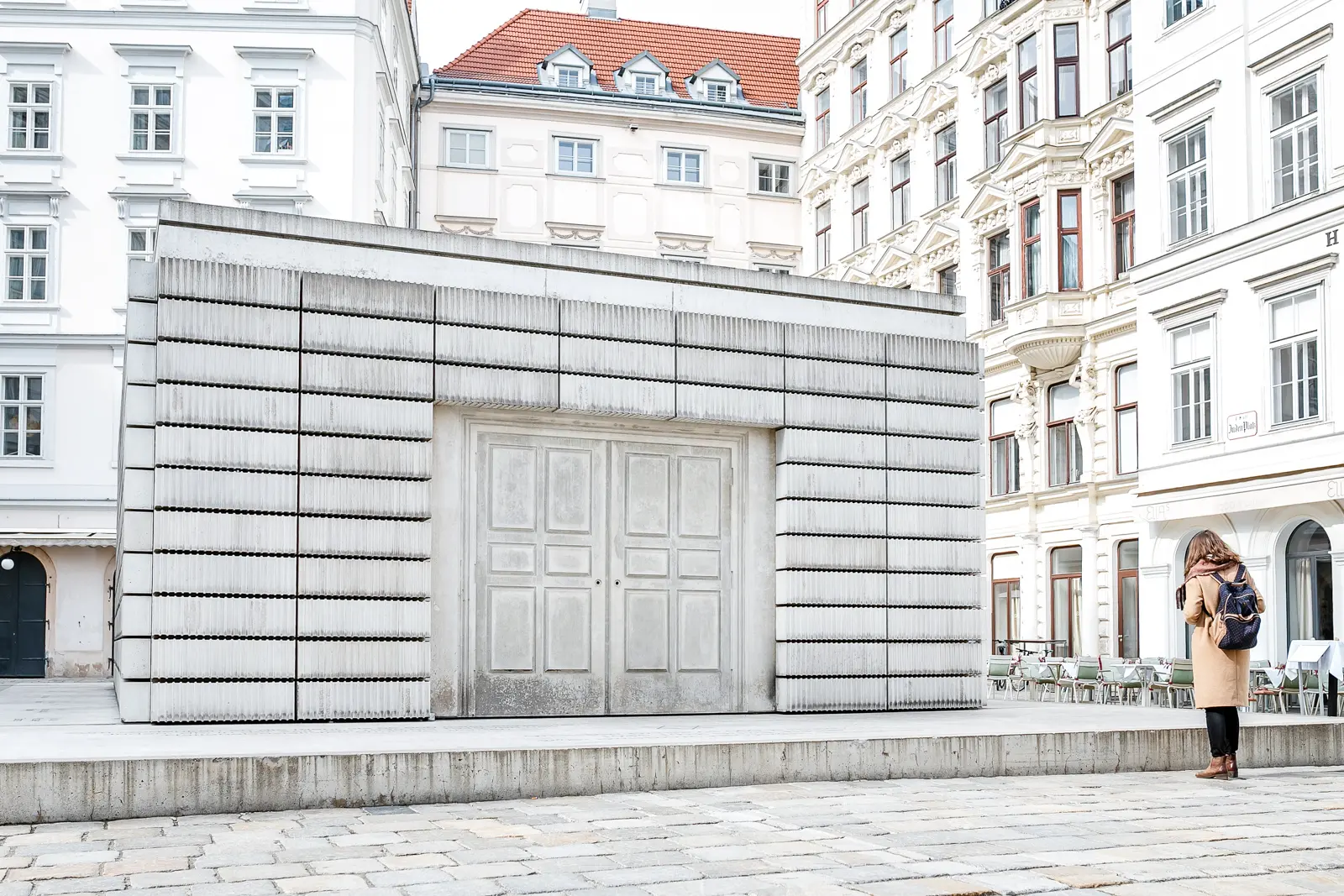 Close-up view of the Holocaust Memorial in Judenplatz Vienna, showing the inward-facing books and sealed doors of Rachel Whiteread's Nameless Library