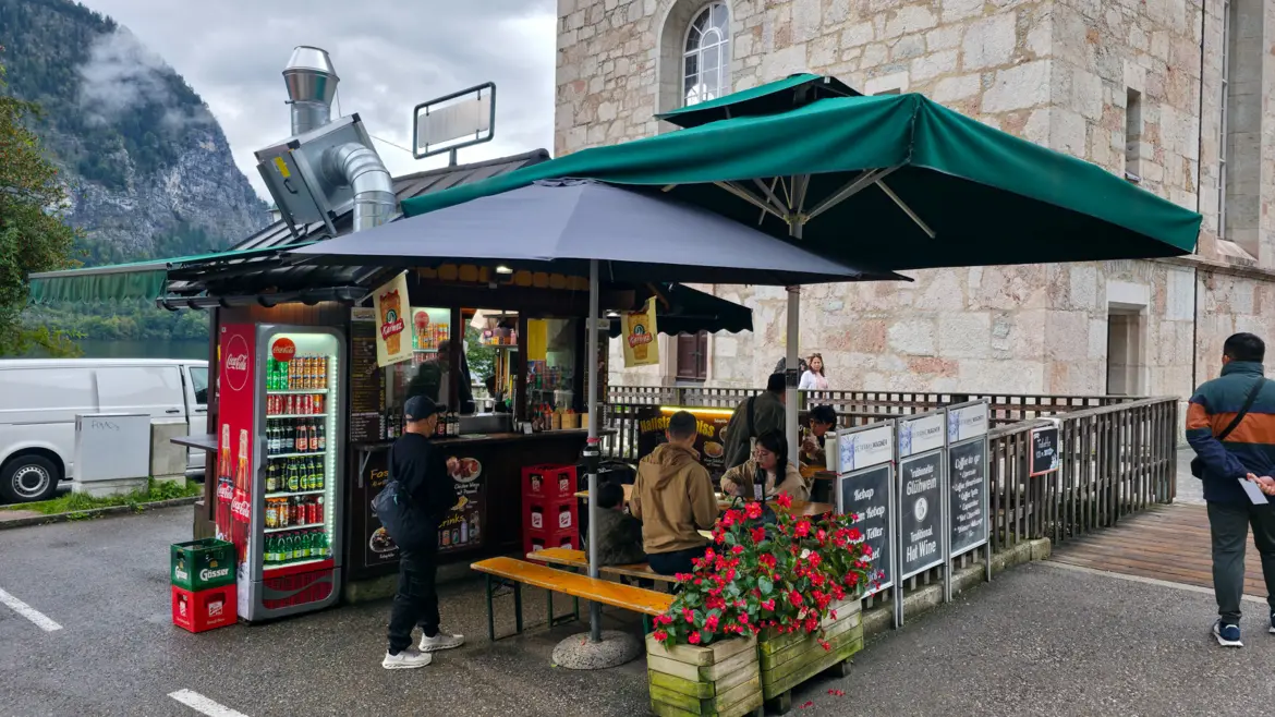 Karmez Kebap Cart, a popular lakeside food stand in Hallstatt, Austria, near the ferry terminal — serving fresh kebabs, wraps, hot dogs, and Austrian beer