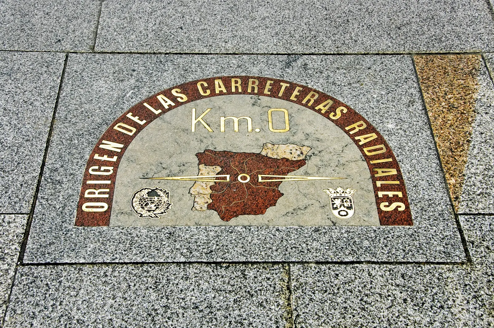 The Kilómetro Cero plaque at Puerta del Sol in Madrid, marking the symbolic starting point of Spain's national road network