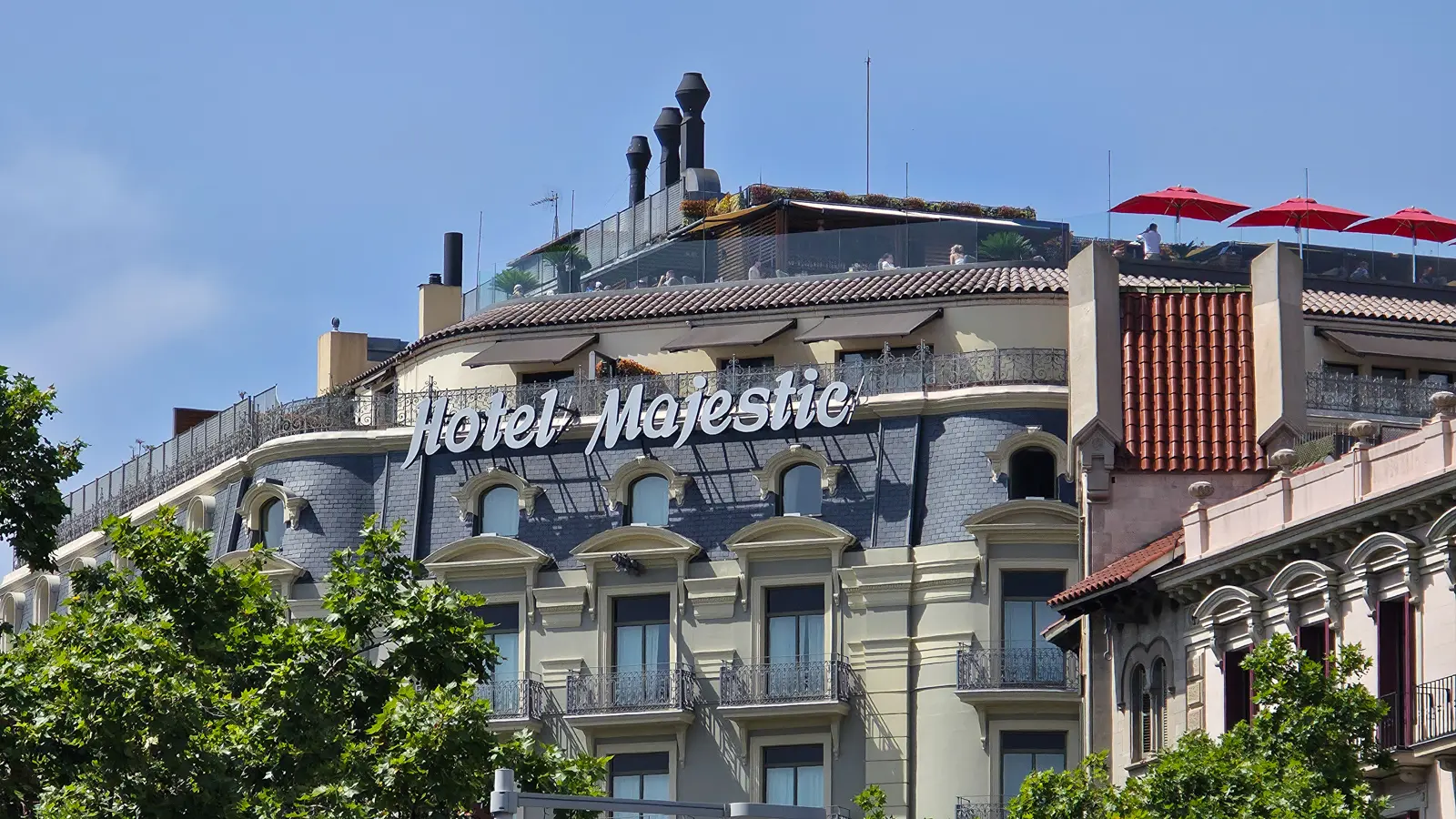 The neoclassical exterior of the Majestic Hotel & Spa on Passeig de Gràcia in Barcelona's Eixample district, a 271-room five-star landmark with nearly a century of history